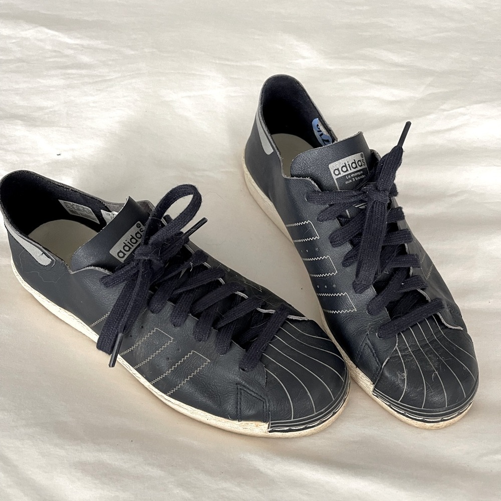 Adidas navy soft leather indoor shoes.